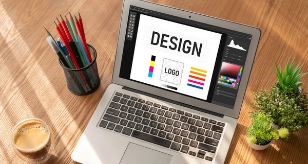 Graphic designer software for modern design of web page and commercial ads showing on the computer screen