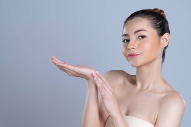 Glamorous beautiful woman with perfect smooth pure clean skincare with soft makeup in isolated background. Beauty hand gesture with expressive facial expression for advertising and indicate promotion.