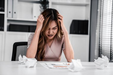 A competent female employee who has become completely exhausted as a result of overburdened work. Concept of unhealthy life as an office worker, office syndrome.