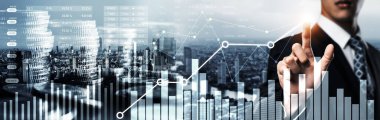 Businessman analyst working with digital finance business data graph showing technology of investment strategy for perceptive financial business decision. Digital economic analysis technology concept.