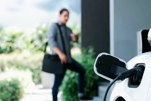 Focus Electric Car Charging Home Charging Station Blurred Progressive Man — Stok fotoğraf