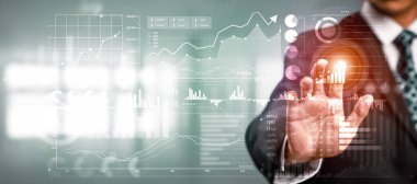 Businessman analyst working with digital finance business data graph showing technology of investment strategy for perceptive financial business decision. Digital economic analysis technology concept.