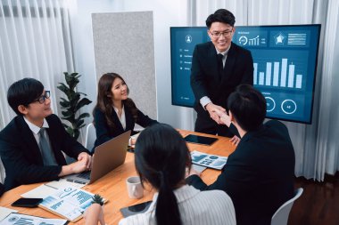 Businesspeople shake hand after successful agreement or meeting. Office worker colleague handshake with business team leader manager for strong teamwork in office to promote harmony and unity concept.