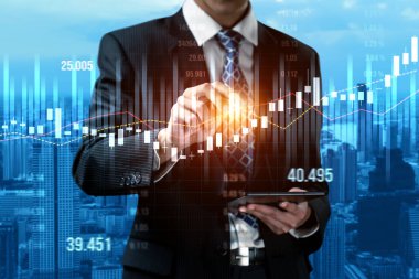 Businessman analyst working with digital finance business data graph showing technology of investment strategy for perceptive financial business decision. Digital economic analysis technology concept.