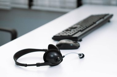Close up image of headphones for competent online working. Customer service operator equipments.