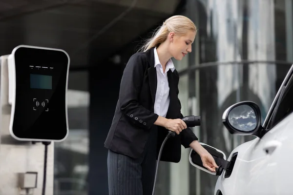 Progressive Businesswoman Insert Charger Plug Charging Station Her Electric Vehicle — 스톡 사진