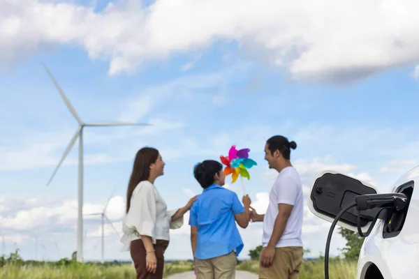 Concept Progressive Happy Family Holding Windmill Toy Relax Wind Farm — 图库照片
