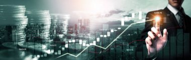 Businessman analyst working with digital finance business data graph showing technology of investment strategy for perceptive financial business decision. Digital economic analysis technology concept.