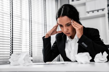 A competent female employee who has become completely exhausted as a result of overburdened work. Concept of unhealthy life as an office worker, office syndrome, effect from overwork.