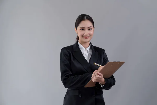 Confident Young Businesswoman Stands Isolated Background Holding Clipboard Posing Formal — Stock Photo, Image