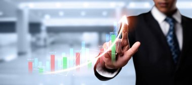 Businessman analyst working with digital finance business data graph showing technology of investment strategy for perceptive financial business decision. Digital economic analysis technology concept.