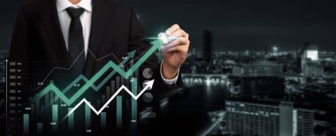 Businessman analyst working with digital finance business data graph showing technology of investment strategy for perceptive financial business decision. Digital economic analysis technology concept.