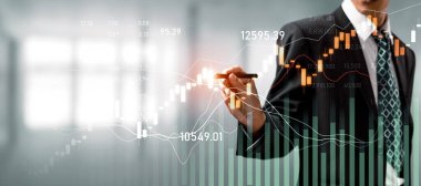 Businessman analyst working with digital finance business data graph showing technology of investment strategy for perceptive financial business decision. Digital economic analysis technology concept.