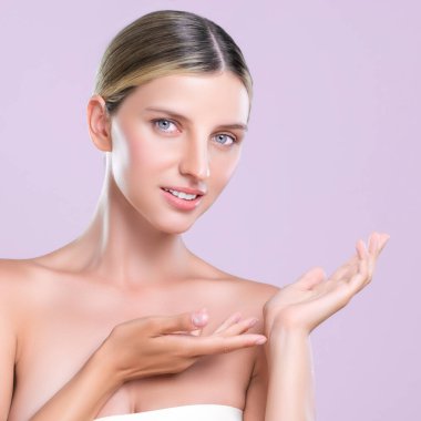 Alluring beautiful woman with perfect smooth and clean skin portrait in isolated background. Beauty hand gesture with expressive facial expression for skincare treatment product or spa.