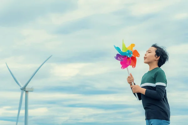 Progressive Young Asian Boy Playing Wind Pinwheel Toy Wind Turbine —  Fotos de Stock