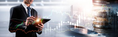 Businessman analyst working with digital finance business data graph showing technology of investment strategy for perceptive financial business decision. Digital economic analysis technology concept.