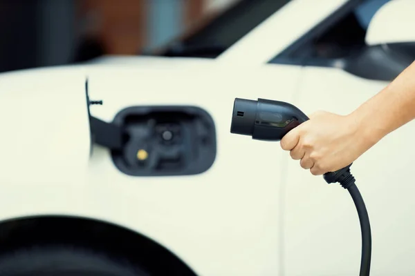 Focus Hand Holding Charger Plug Blurred Background Progressive Electric Vehicle — 스톡 사진