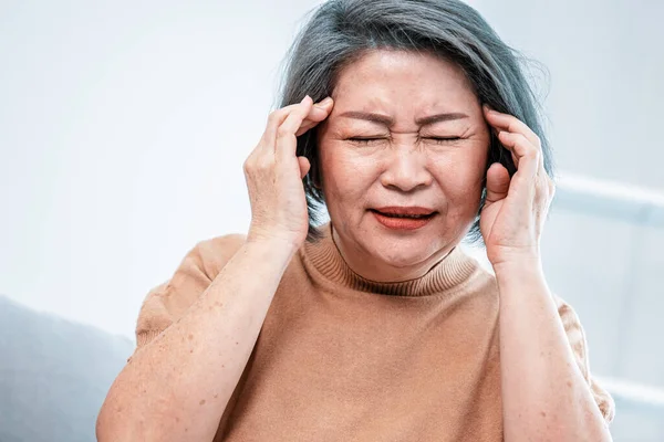 Agonizing Senior Woman Headache Compress Her Temple Both Hands Her — Stockfoto