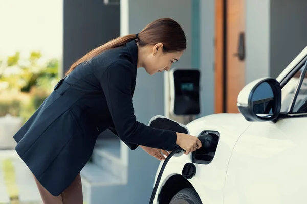 Progressive Woman Install Cable Plug Her Electric Car Home Charging — Photo