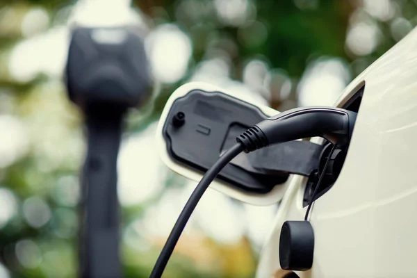 Focus Charger Plugged Progressive Rechargeable Electric Car Blur Background Natural — Foto de Stock