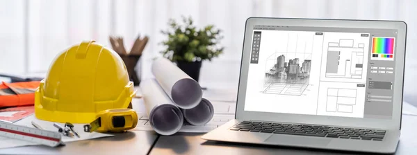 stock image Digital blueprint by architecture design software on laptop screen with documents and blueprint layout on office table seamless integration of technology and traditional drafting method. Insight