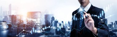 Businessman analyst working with digital finance business data graph showing technology of investment strategy for perceptive financial business decision. Digital economic analysis technology concept.