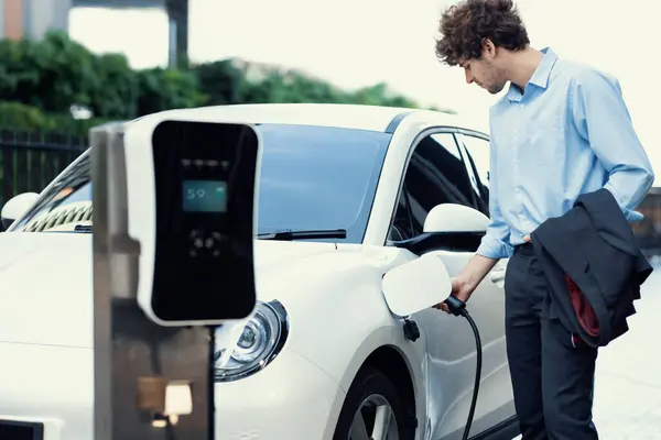 Progressive Businessman Insert Charger Plug Charging Station His Electric Vehicle — Φωτογραφία Αρχείου
