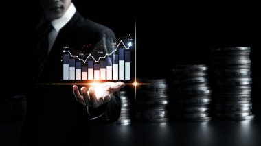 Businessman analyst working with digital finance business data graph showing technology of investment strategy for perceptive financial business decision. Digital economic analysis technology concept.