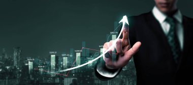 Businessman analyst working with digital finance business data graph showing technology of investment strategy for perceptive financial business decision. Digital economic analysis technology concept.