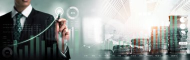 Businessman analyst working with digital finance business data graph showing technology of investment strategy for perceptive financial business decision. Digital economic analysis technology concept.
