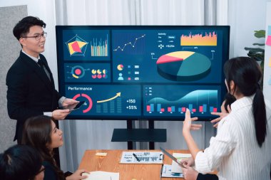 Confidence and asian businessman give presentation on financial analyzed by business intelligence in dashboard report to other people in board room meeting to promote harmony in workplace.