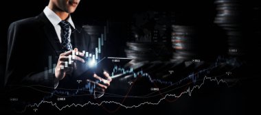 Businessman analyst working with digital finance business data graph showing technology of investment strategy for perceptive financial business decision. Digital economic analysis technology concept.