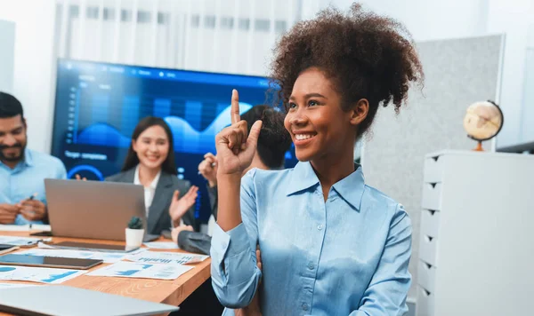 stock image Portrait of happy young african businesswoman with group of office worker on meeting with screen display business dashboard in background. Confident office lady at team meeting. Concord