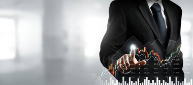 Businessman analyst working with digital finance business data graph showing technology of investment strategy for perceptive financial business decision. Digital economic analysis technology concept.