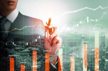 Businessman analyst working with digital finance business data graph showing technology of investment strategy for perceptive financial business decision. Digital economic analysis technology concept.