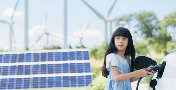 Playful Girl Holding Plug Home Charging Station Providing Sustainable Power — Stock Photo, Image