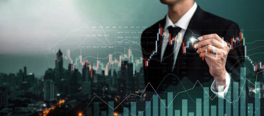 Businessman analyst working with digital finance business data graph showing technology of investment strategy for perceptive financial business decision. Digital economic analysis technology concept.