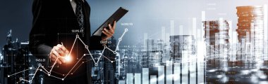 Businessman analyst working with digital finance business data graph showing technology of investment strategy for perceptive financial business decision. Digital economic analysis technology concept.