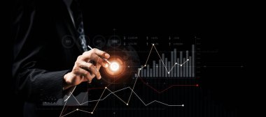 Businessman analyst working with digital finance business data graph showing technology of investment strategy for perceptive financial business decision. Digital economic analysis technology concept.