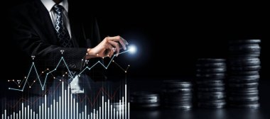 Businessman analyst working with digital finance business data graph showing technology of investment strategy for perceptive financial business decision. Digital economic analysis technology concept.