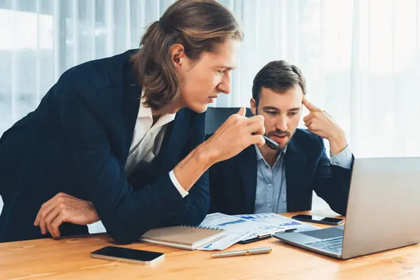 stock image Busy analyst team in office analyzing financial data analysis for marketing strategy in workspace using BI dashboard with graph and chart to improve business performance. Entity