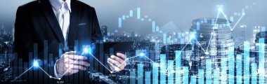 Businessman analyst working with digital finance business data graph showing technology of investment strategy for perceptive financial business decision. Digital economic analysis technology concept.