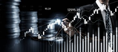 Businessman analyst working with digital finance business data graph showing technology of investment strategy for perceptive financial business decision. Digital economic analysis technology concept.