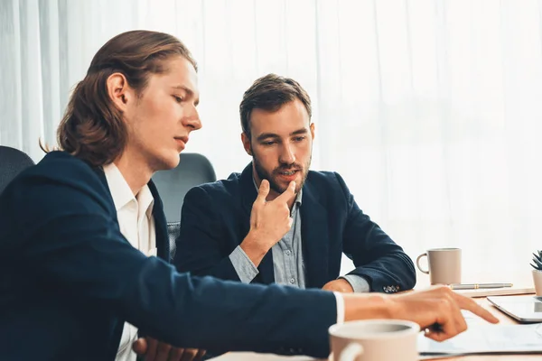 Stock image Busy analyst team in office analyzing financial data analysis for marketing strategy in workspace using BI dashboard with graph and chart to improve business performance. Entity