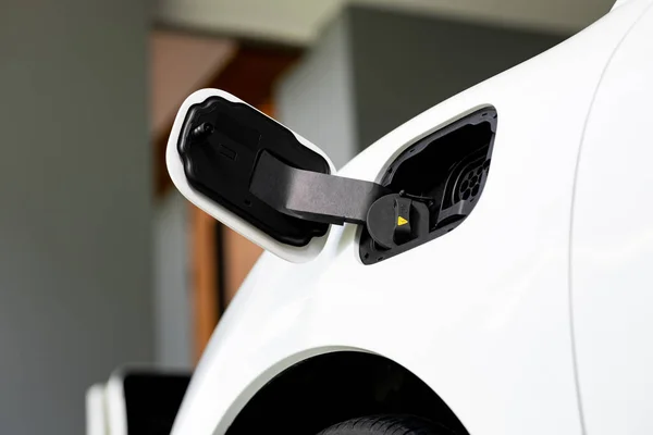 Closeup Electric Vehicle Plugged Cable Charging Point Powered Progressive Concept — 图库照片