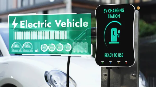 Charging station for EV car to recharge electricity display smart battery status hologram by EV charger cable. Technological advancement of futuristic eco-friendly EV and energy sustainability. Peruse