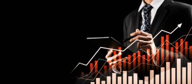 Businessman analyst working with digital finance business data graph showing technology of investment strategy for perceptive financial business decision. Digital economic analysis technology concept.