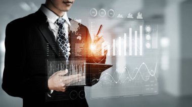 Businessman analyst working with digital finance business data graph showing technology of investment strategy for perceptive financial business decision. Digital economic analysis technology concept.