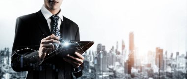 Businessman analyst working with digital finance business data graph showing technology of investment strategy for perceptive financial business decision. Digital economic analysis technology concept.