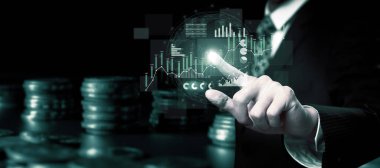 Businessman analyst working with digital finance business data graph showing technology of investment strategy for perceptive financial business decision. Digital economic analysis technology concept.